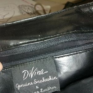 This is a snake skin purse. Real leather inside.